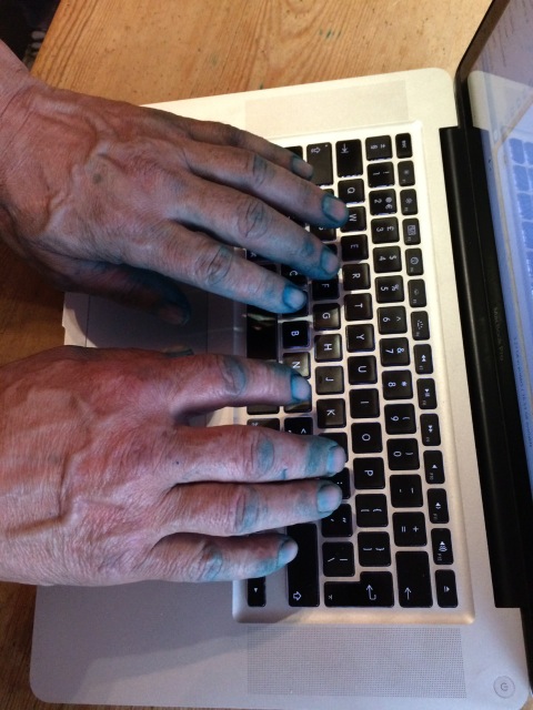 Photo of the hands of a farmer straight from chicken vaccine to keyboard