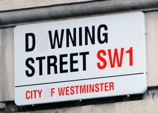 Modified Downing Street sign with letter Os removed. Original image by Sergeant Tom Robinson RLC MOD from Wikipedia Commons