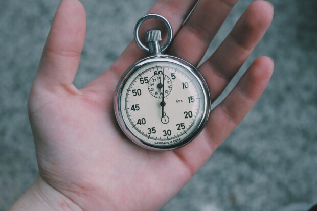 photo of stop watch in hand